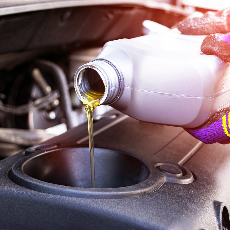 oil being added to a car engine