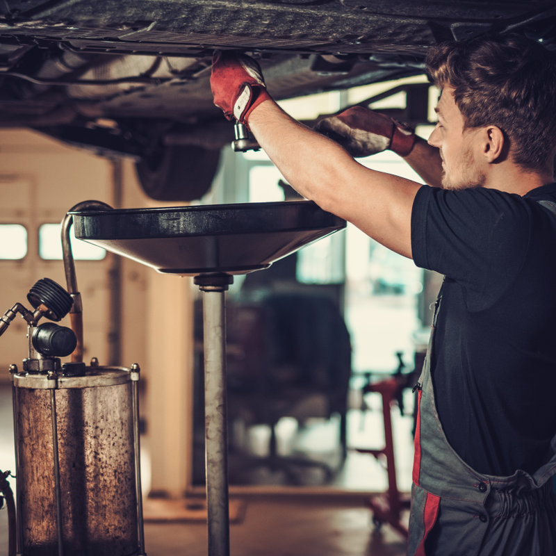 mechanic providing oil change service