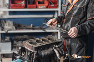 mechanic repairs a head gasket